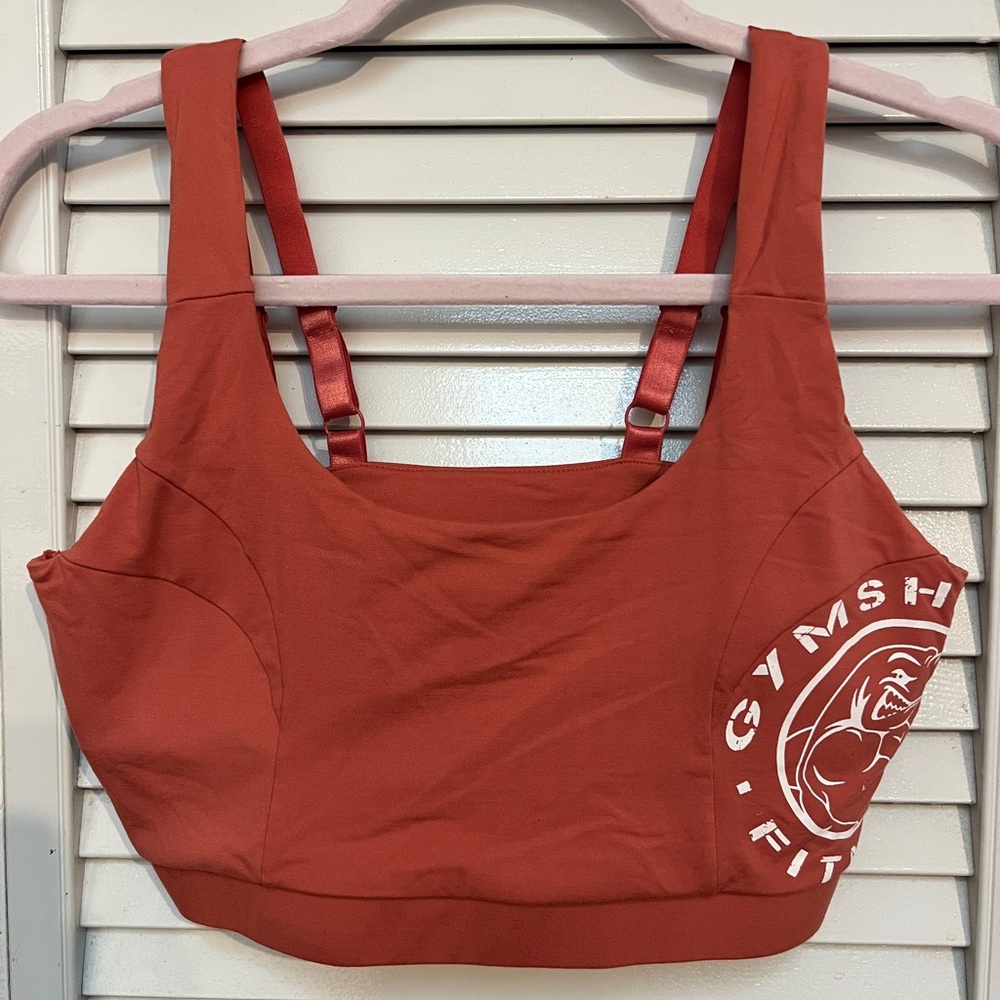 Reddish orange gymshark legacy sports bra